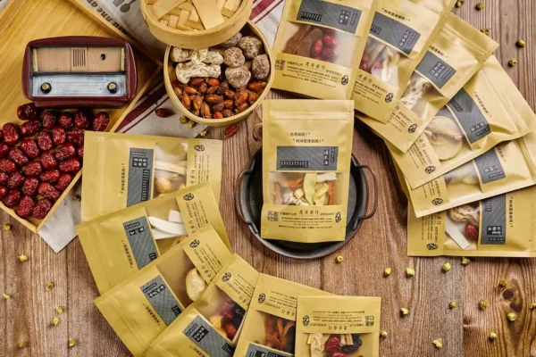 Assorted traditional Chinese herbal formula packs by Wong Shook Phing, featuring dried herbs for wellness soups and TCM remedies.